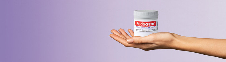 hand holding sudocrem