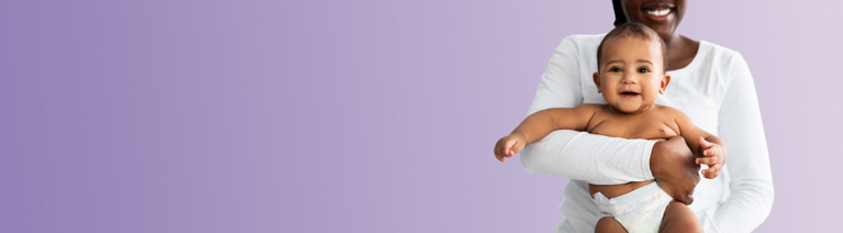 woman holding a happy baby