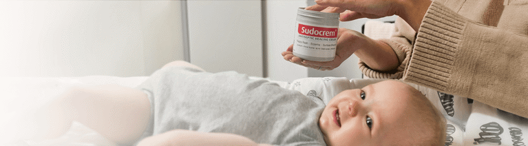 Baby posing with Sudocrem Nappy Rash