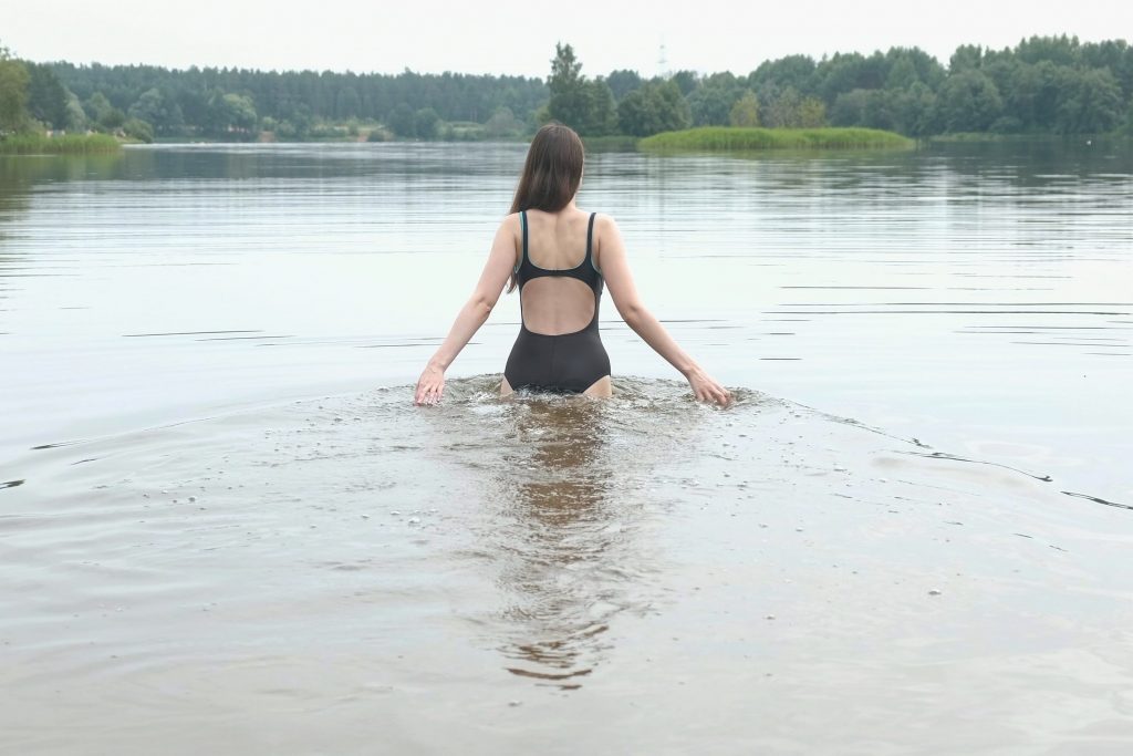 Woman going swimming in freezing cold water
