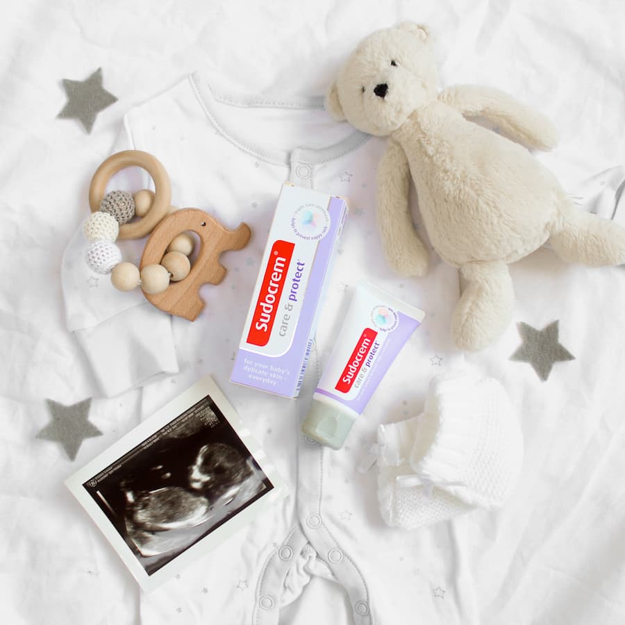 Sudocrem next to a teddy bear.